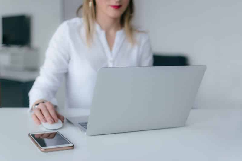 girl using dating app on laptop